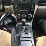 arafed view of a car’s interior with a manual gear shift