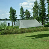a tent is set up on the grass