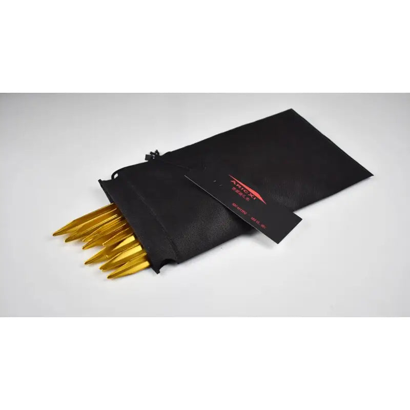 a black bag with gold bullet shells inside