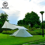 a tent with a white canopy on the grass