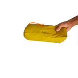 a hand holding a yellow bag with a white background