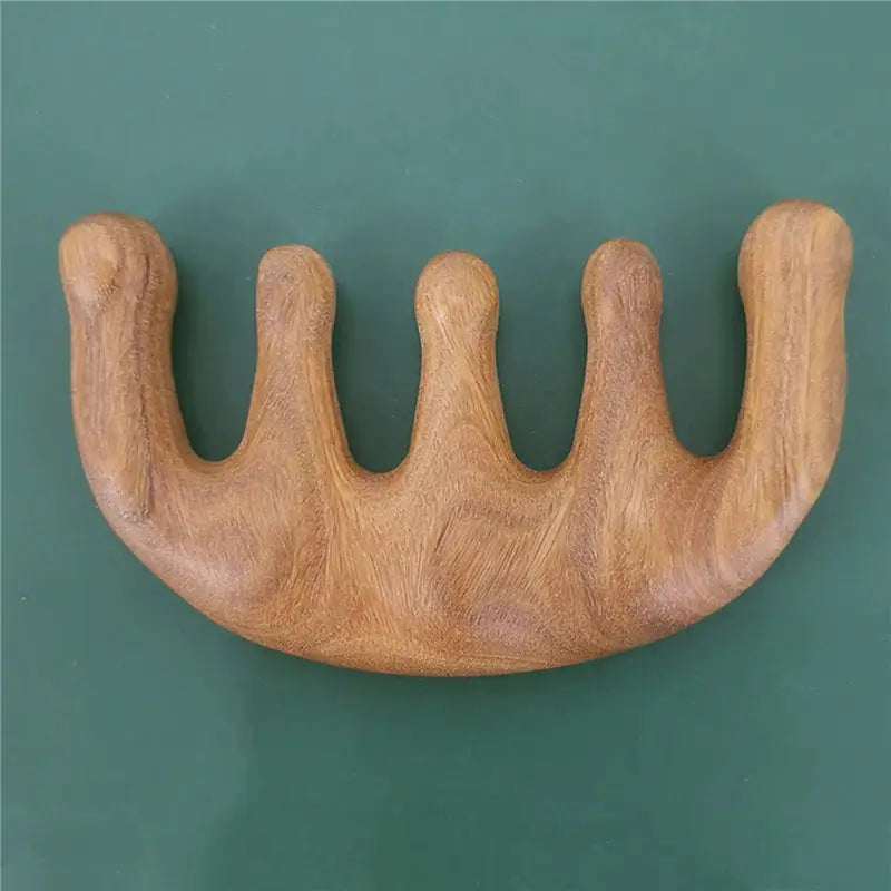 a wooden teeth with a green background