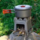 a small stove with a pot on top of it