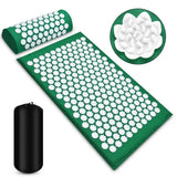 a green mat with white flowers and a black roll