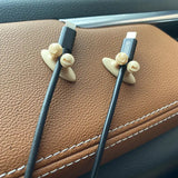 a pair of earphones sitting on top of a car seat