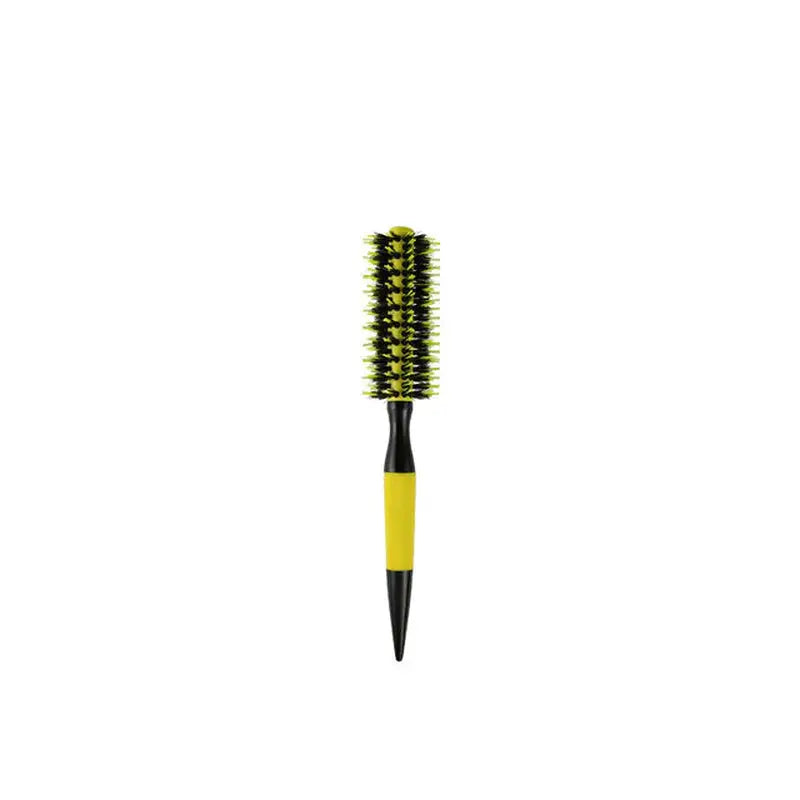 a yellow brush with black handle