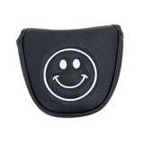 a black leather car key case with a smiley face