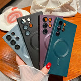 a woman holding a phone case with four different colors