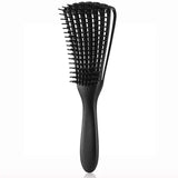 a black brush with a black handle