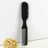 a black comb with a ball of yarn next to it