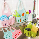 a sink with several colorful baskets hanging on the wall