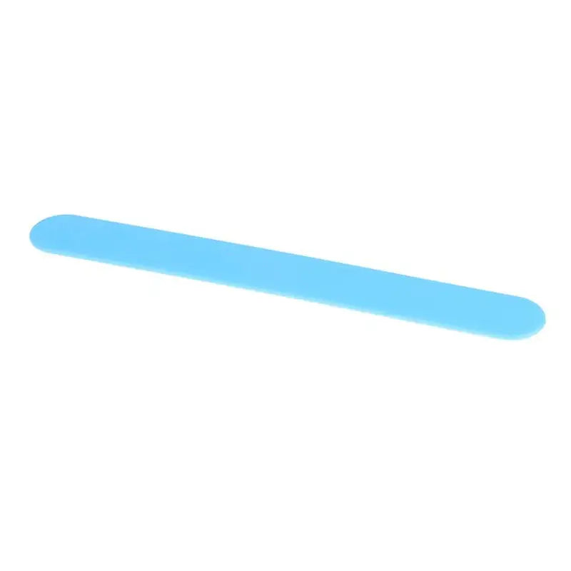 a close up of a blue plastic nail file on a white background