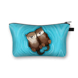 a blue cosmetic bag with a cartoon otter on it