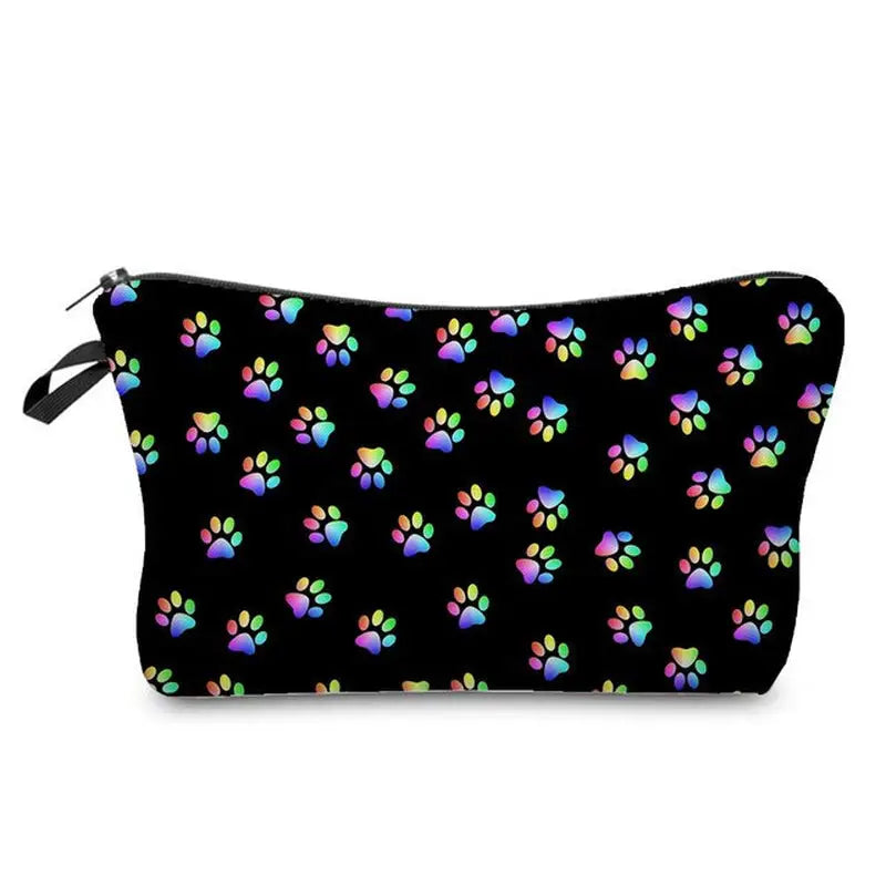 a black cosmetic bag with colorful paw prints