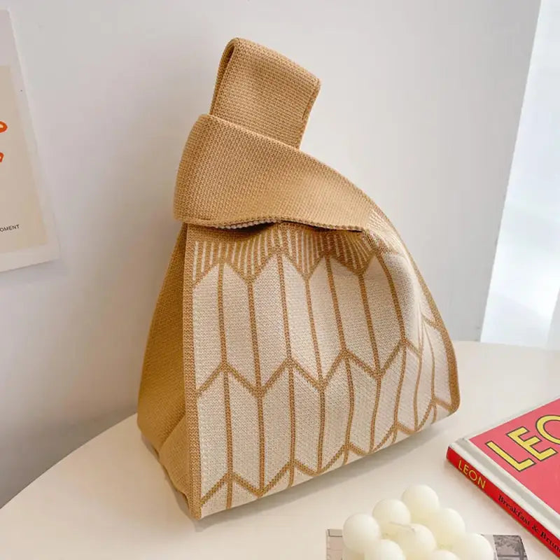 a bag with a book and some candles