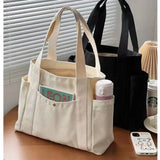there is a bag with a bottle of coffee and a cell phone