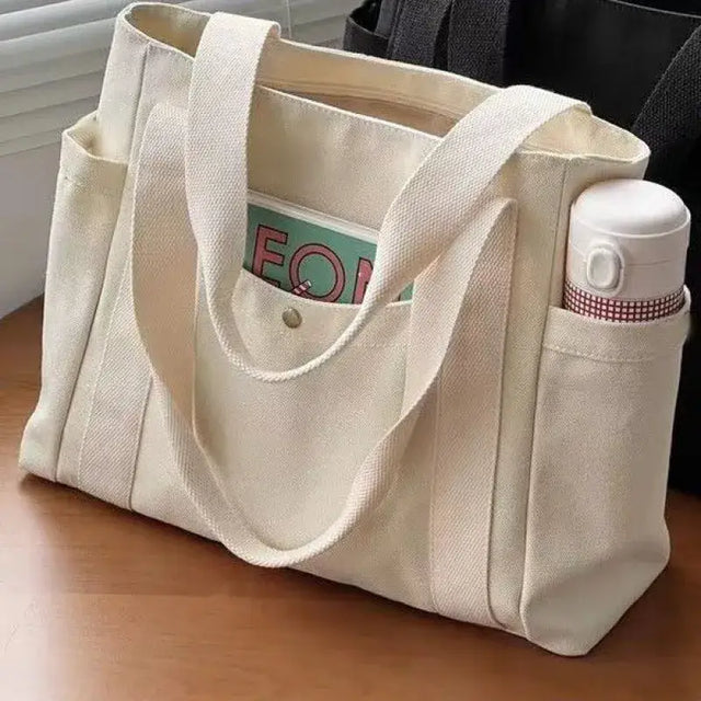 there is a bag with a bottle and a bottle holder on a table