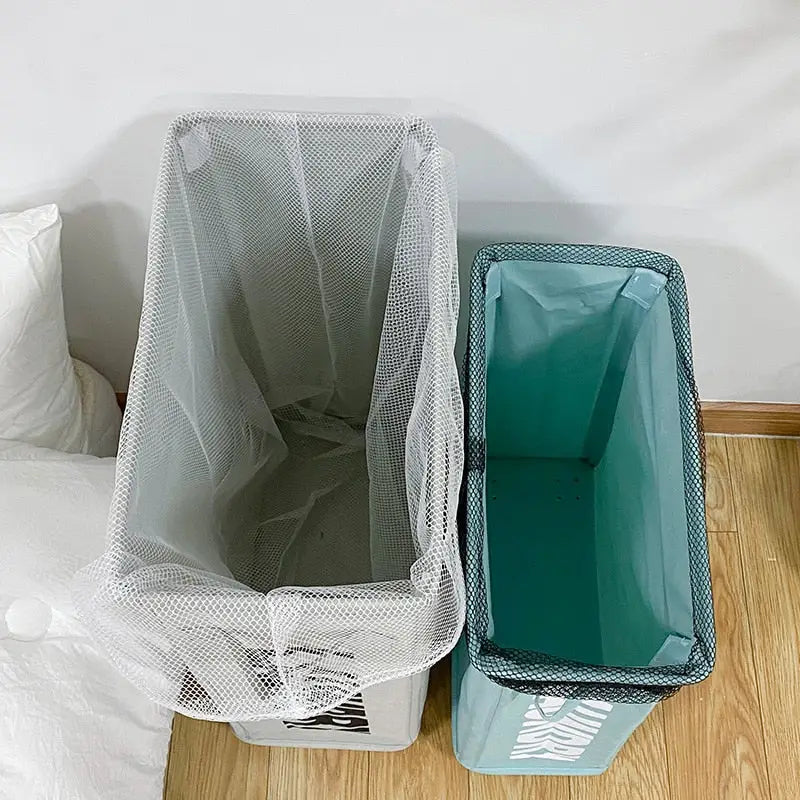 a white bed with a green trash bag