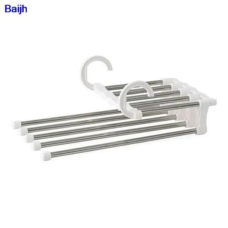 a white plastic rack with three metal rods
