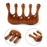 a wooden toy with a hand shaped like a hand