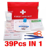 a first aid kit with scissors and a red bag