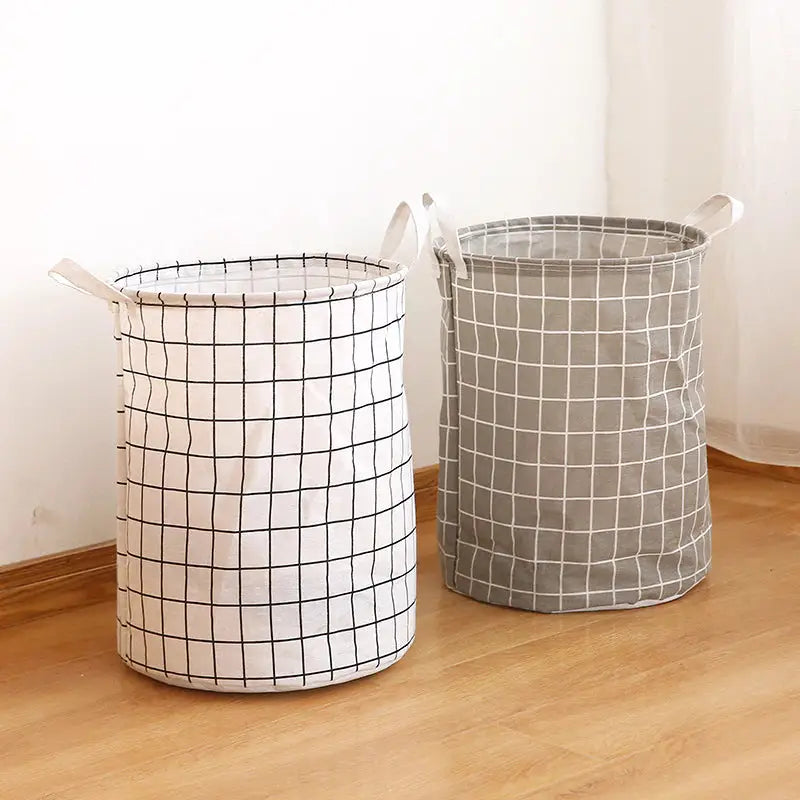 two laundry baskets on the floor