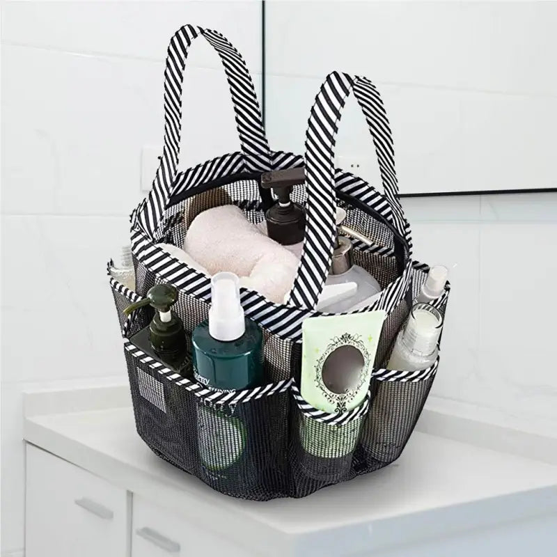 a black and white basket with a lot of items inside