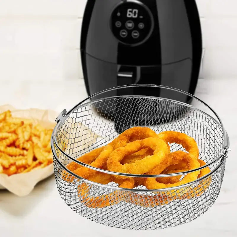 there is a basket of onion rings and a bowl of fries