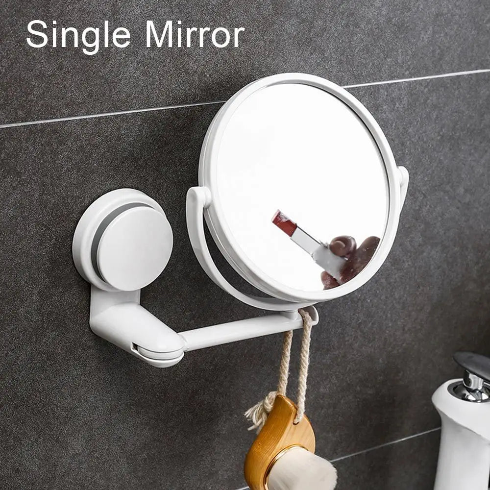 a bathroom mirror hanging on the wall