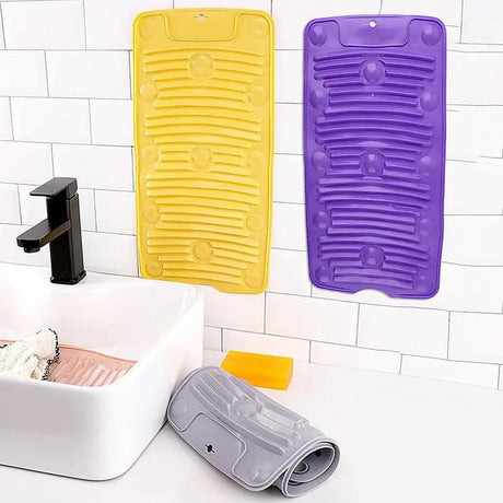a bathroom sink with a yellow and purple mat