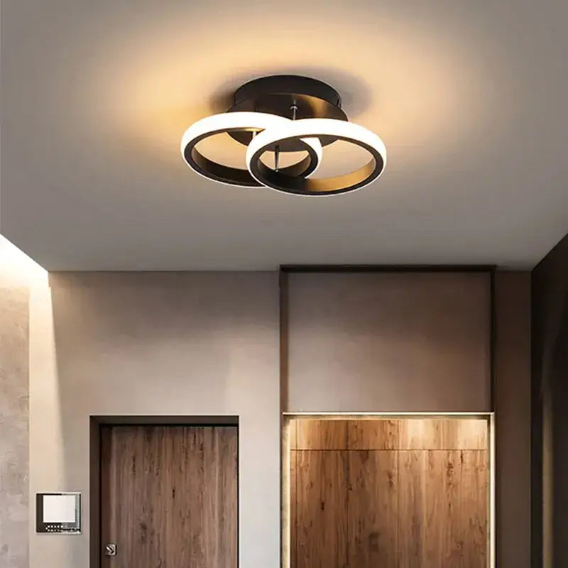 a bathroom with a wooden floor and a light fixture