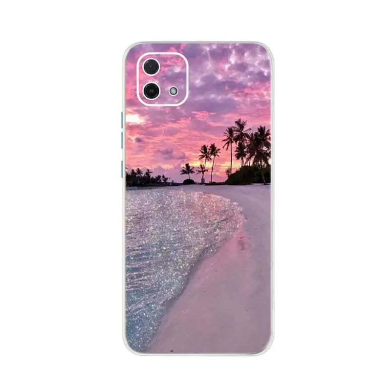 a beach scene with palm trees and a pink sunset phone case
