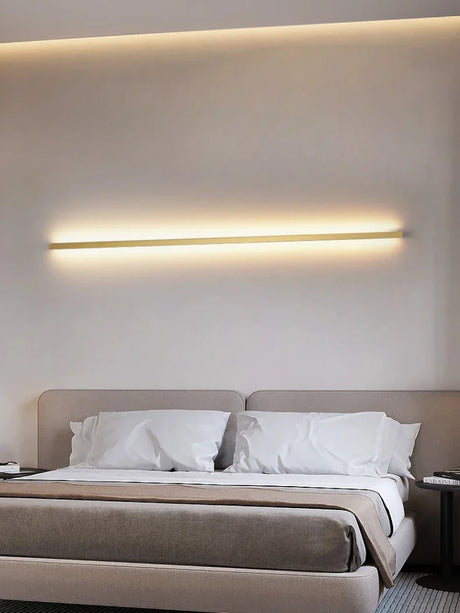 a bed with a light above it