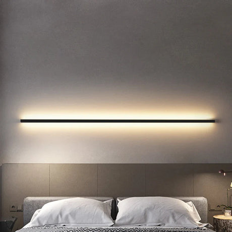 a bed with a light above it