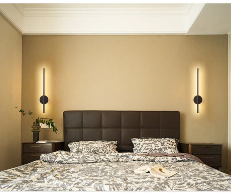 a bed with a white and black comforter