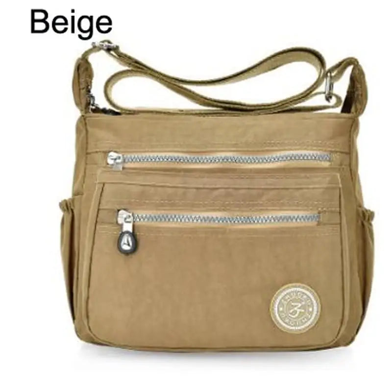 a close up of a beige bag with a zipper on the front