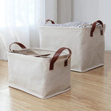 two canvas storage bags on a wooden floor