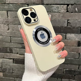 Beige iPhone case with a circular metallic accent around the Apple logo cutout.