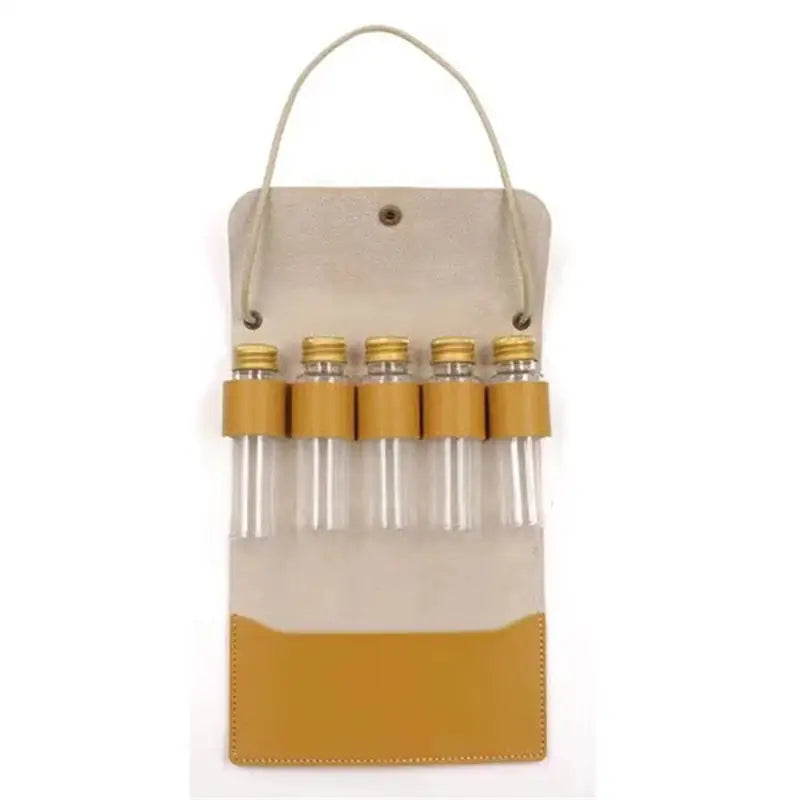 a yellow and white leather wine bottle carrier