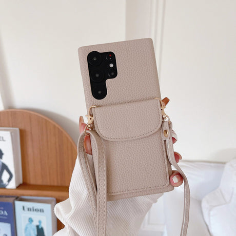 Beige leather phone case with a crossbody strap and front pocket.