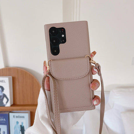 Beige leather phone case with a crossbody strap and camera cutout.