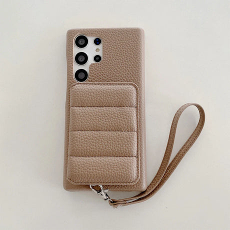 Beige leather smartphone case with a card holder and wrist strap.