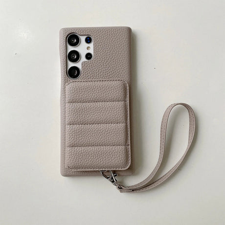 Beige leather smartphone case with a card holder and wrist strap.