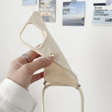 Beige phone case with strap.