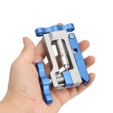 a hand holding a blue metal device