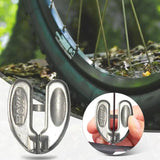 a bicycle wheel lock with a hand holding it