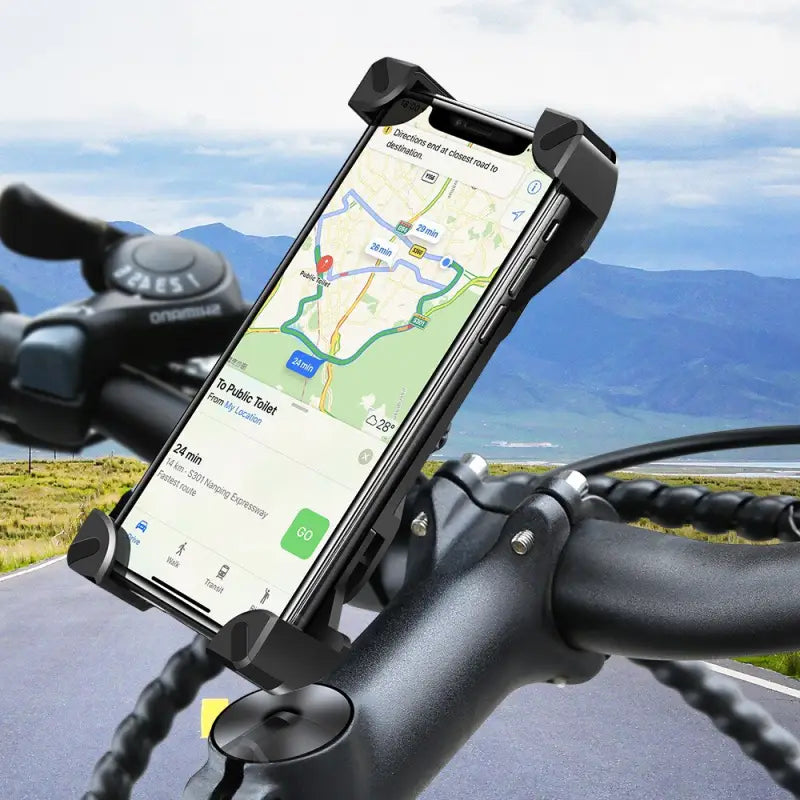 the bike phone holder is attached to the handle of a bike