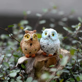 two birds sitting on top of a tree stump