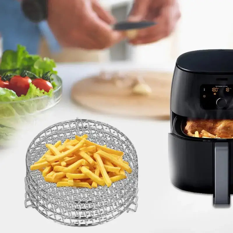 a black air fryer with fries and fries