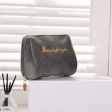 a black bag with the word beauty written on it